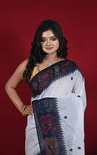 Front drape showing black ikat border and star butis on white cotton