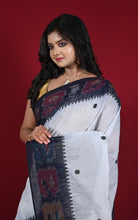 Close-up of black ikat temple border and woven star motif detail