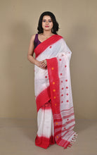 Model in white Begampuri handloom cotton saree with red star buti and red border