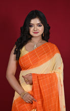 Close-up front view showing orange checks and heart motif detail