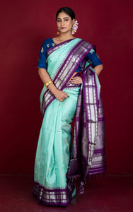 Handwoven Exclusive Gadwal Silk Saree in Aqua Green, Luxury Purple and Silver Zari Work