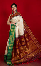 Exclusive Woven Ganga Jamuna Border Gadwal Silk Saree in Almond Beige, Dark Maroon, Dartmouth Green and Golden Zari Weave