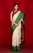Exclusive Woven Ganga Jamuna Border Gadwal Silk Saree in Almond Beige, Dark Maroon, Dartmouth Green and Golden Zari Weave