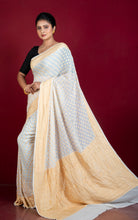 Handwoven Nakshi Skirt Border Khaddi Georgette Banarasi Saree in Off white and Matt Gold