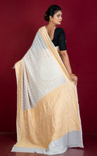 Handwoven Nakshi Skirt Border Khaddi Georgette Banarasi Saree in Off white and Matt Gold