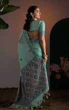 Title
Soft Cotton Woven Ajrakh Jamdani Saree Thread Nakshi Work in Sea Green and Multicolored
