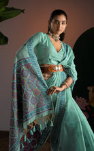 Title
Soft Cotton Woven Ajrakh Jamdani Saree Thread Nakshi Work in Sea Green and Multicolored
