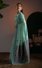 Title
Soft Cotton Woven Ajrakh Jamdani Saree Thread Nakshi Work in Sea Green and Multicolored
