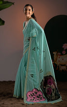 Model wearing aqua green Jamdani saree with matching blouse showcasing handloom floral medallion details.

Target Keywords: sea green jamdani