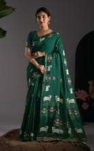 Front view of emerald green soft cotton Jamdani saree featuring traditional white cow and lotus motifs