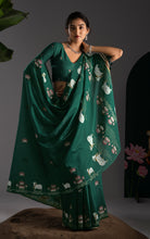 Elegant drape showcasing the decorative Jamdani pallu with floral and cow woven motifs.