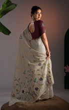 Back view showing the full pallu spread of an off-white Jamdani saree with intricate bird, deer, and floral vines.