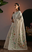 Model wearing natural cream Jamdani saree with brown contrast blouse showcasing handloom deer and floral weave details.