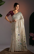 Off-white handwoven soft Jamdani saree with floral vine embroidery and bird motifs, full-length front view model shot.