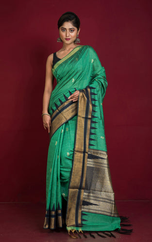 Handwoven Crowned Temple Border Tussar Raw Silk Saree in Emerald Green and Black with Rich Pallu