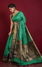 Handwoven Crowned Temple Border Tussar Raw Silk Saree in Emerald Green and Black with Rich Pallu