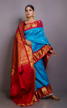 Exclusive Gadwal Silk Saree in Maya Blue,Twill Rani Pink and Golden Zari Work